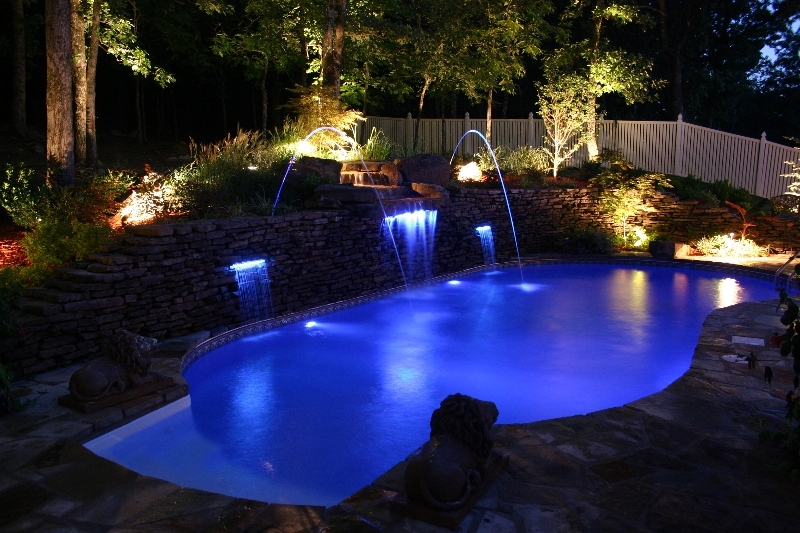 Burton Pools & Spas pool renovation company near me transforms a swimming pool with LED lighting and water features.